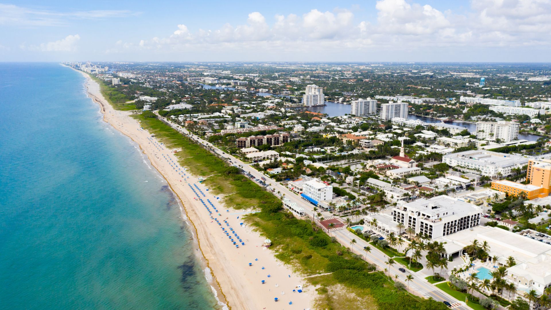 Aerial drone view of a residential property and surrounding streets
