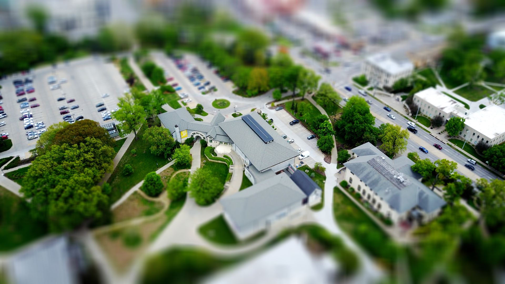 Aerial drone photo of a commercial property and parking area from above